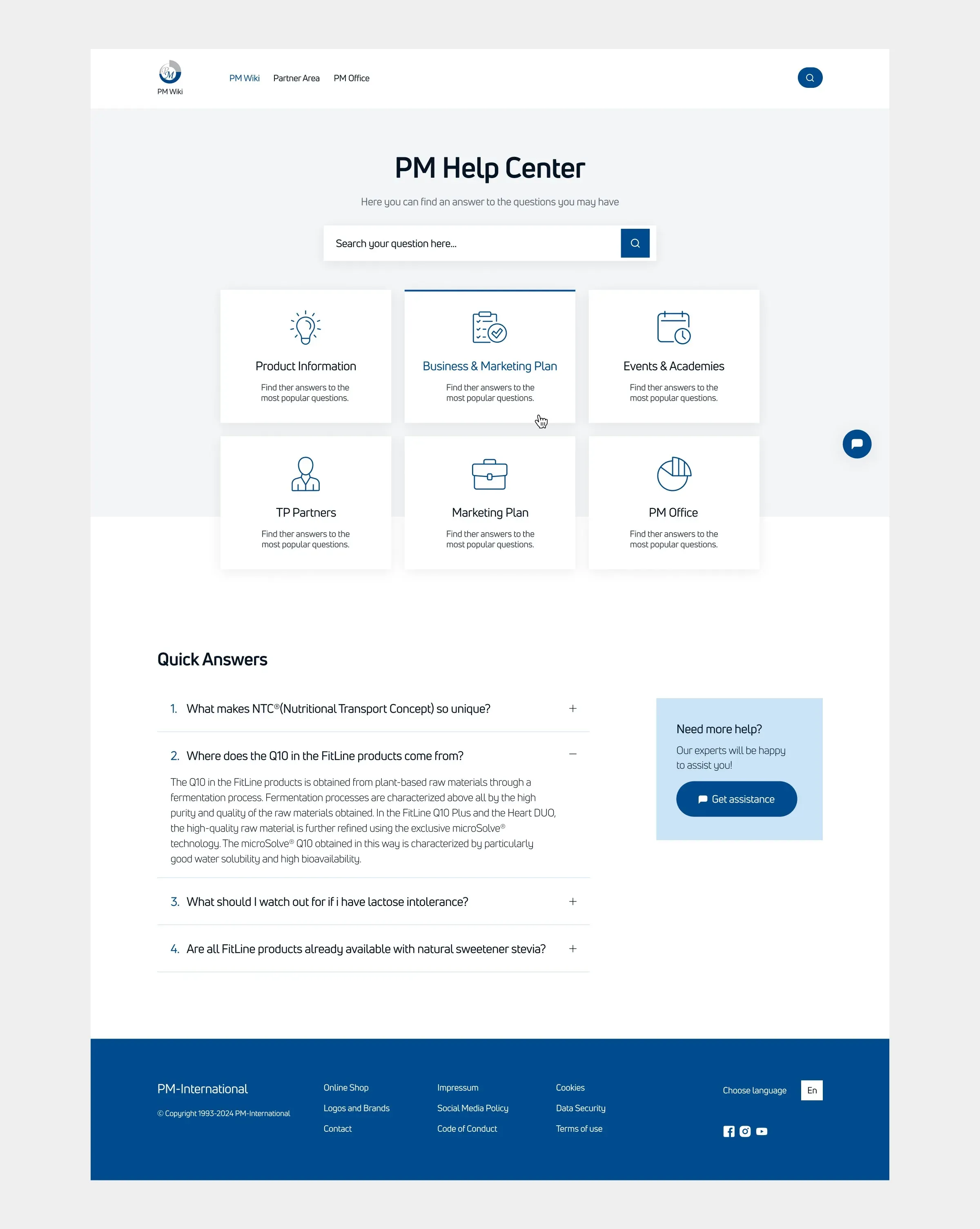 The PM Wiki desktop home page in full, with search, topic cards and a quick answers section.